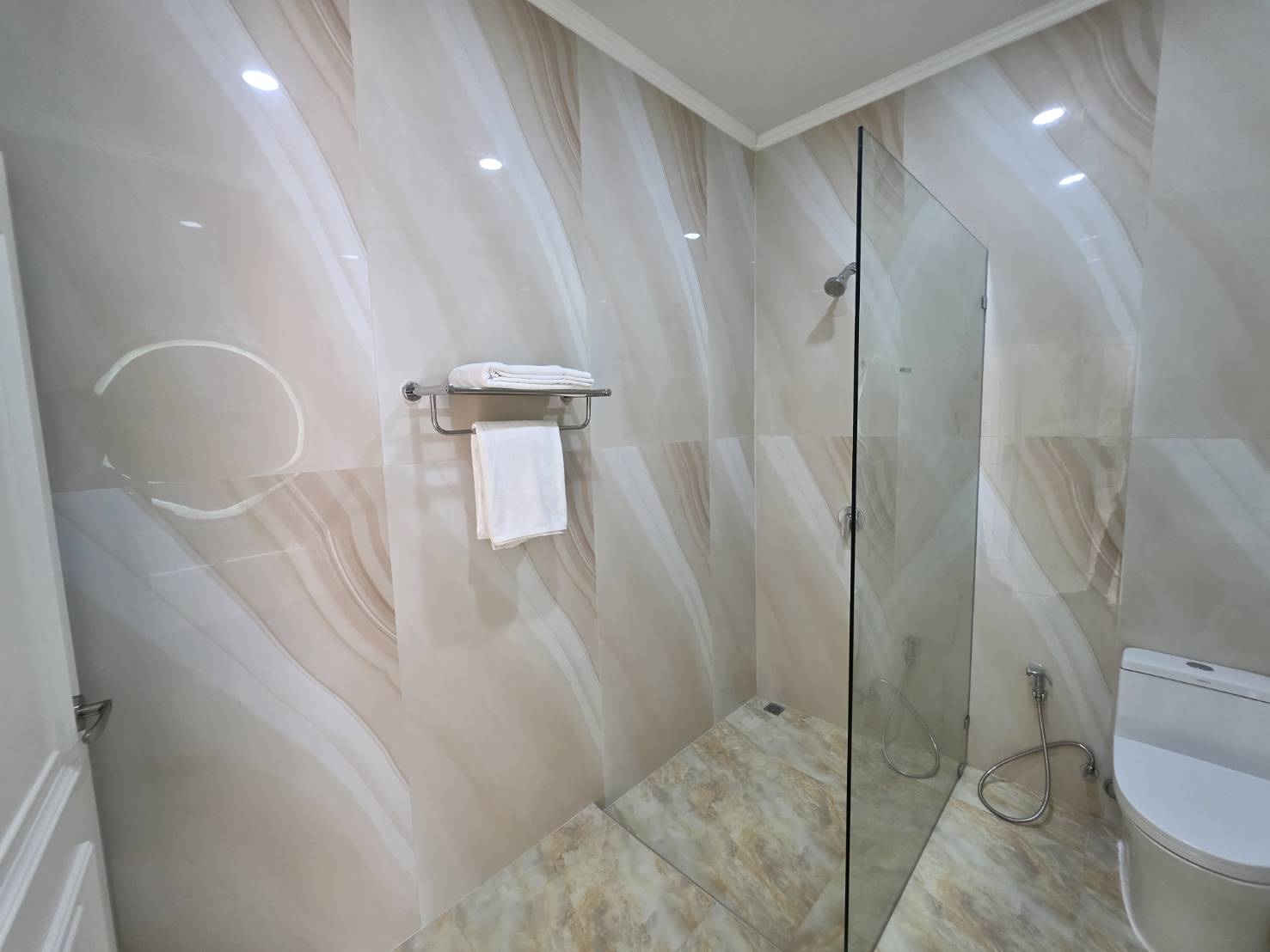 Modern walk-in shower with sleek design in the Sea View Room at Ta Yai Beach Resort, Koh Larn