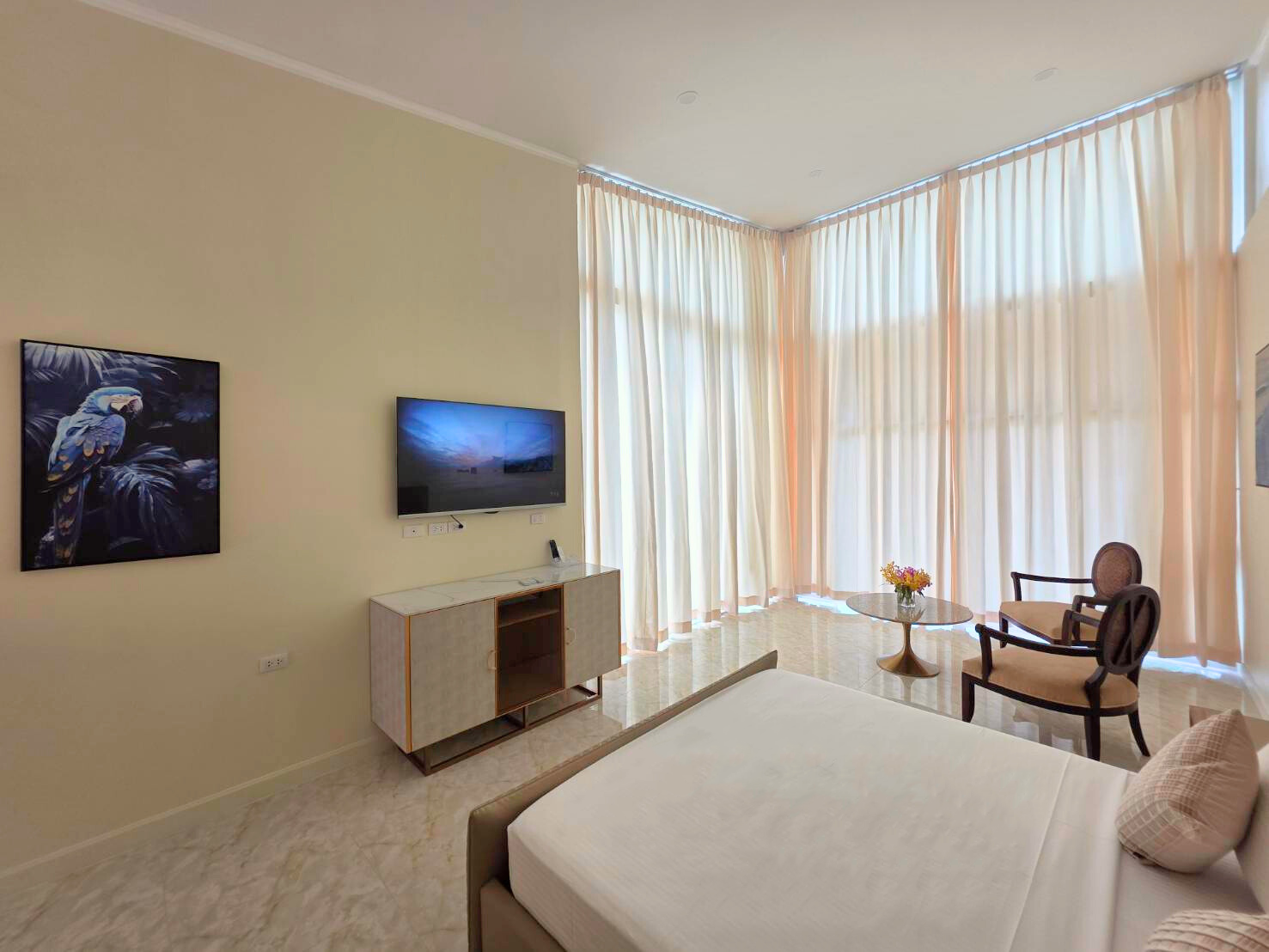 Sea View Room at Ta Yai Beach Resort with closed shades for privacy and comfort